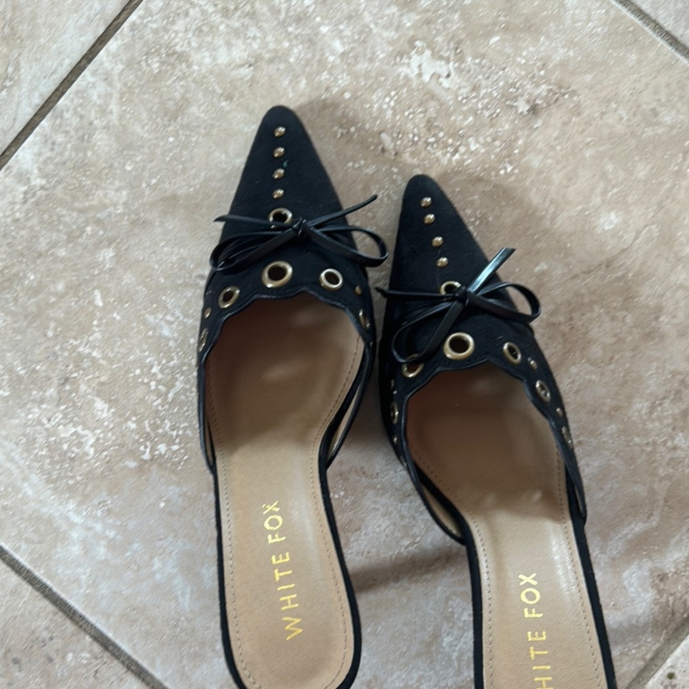 Studded bow heel never worn